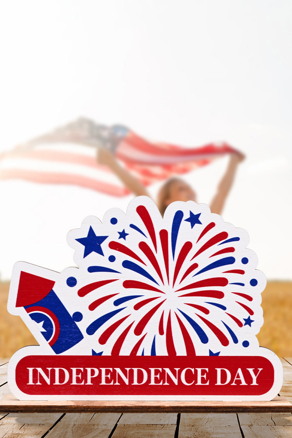 Patriotic Americana wooden tabletop decor with fireworks and Independence Day text.