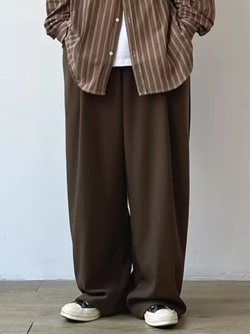 Men's relaxed fit flowy sweatpants in chocolate brown, with a wide leg and casual styling.