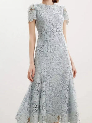 Light blue floral lace mermaid evening gown with cap sleeves and scalloped hem.