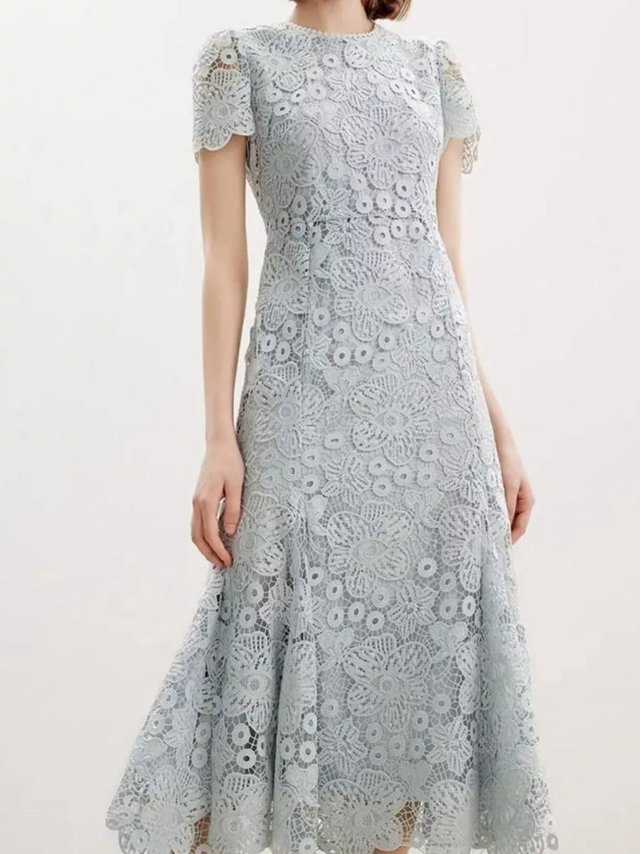 Light blue floral lace mermaid evening gown with cap sleeves and scalloped hem.
