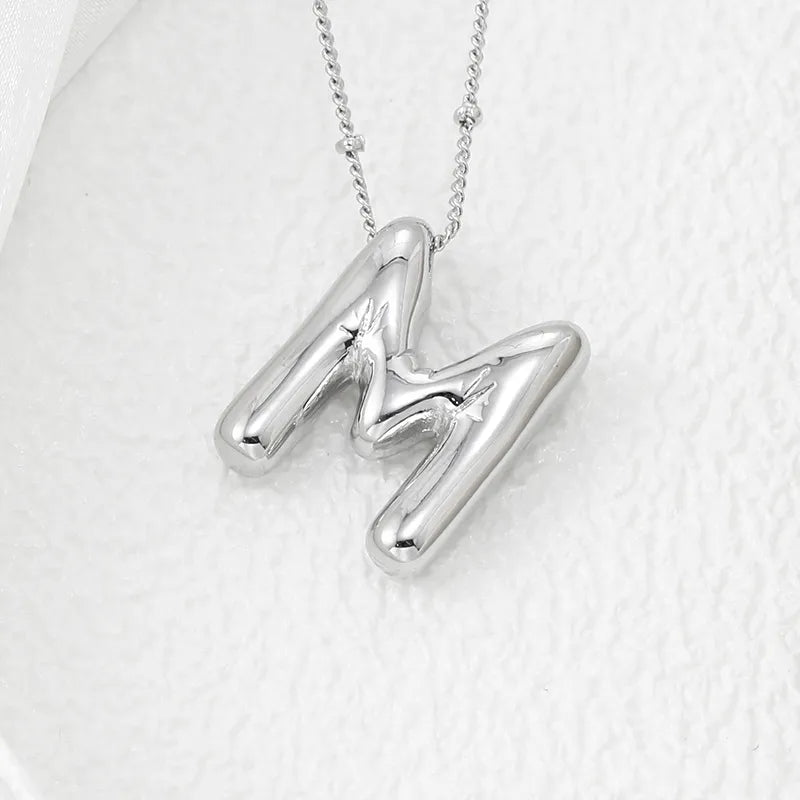 Silver letter M pendant necklace with beaded chain