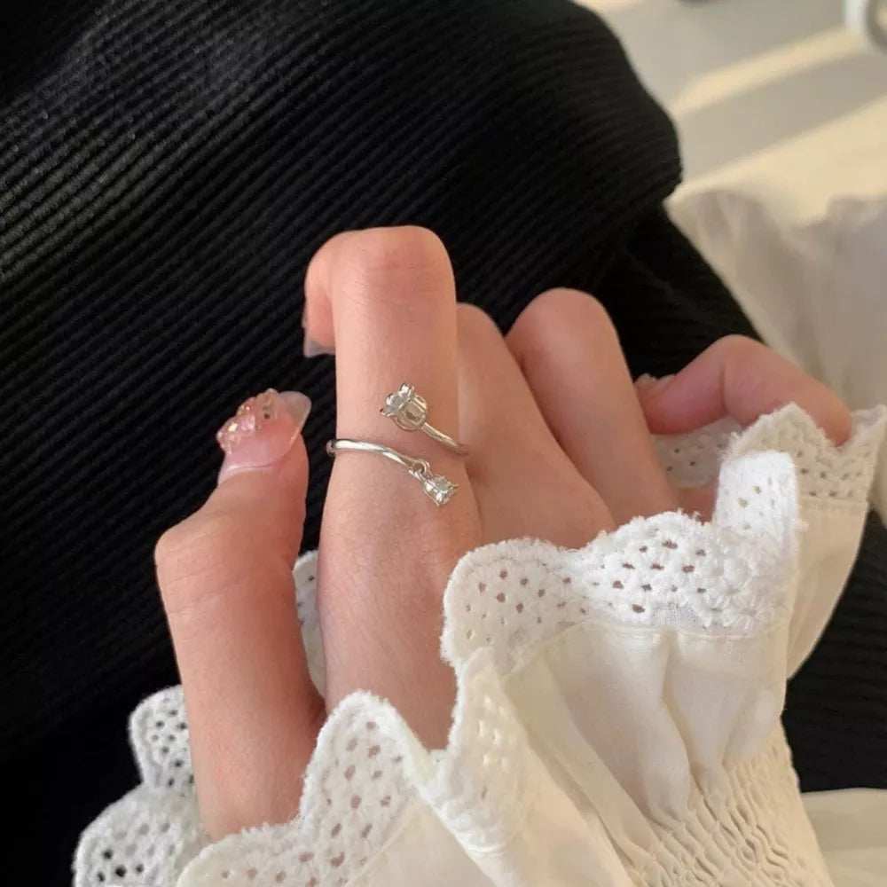 ring in silver featuring bypass design and fitted fit