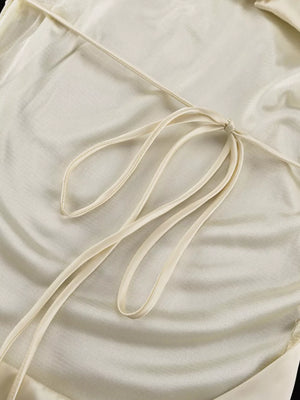 Cream satin halter top with tie back detail