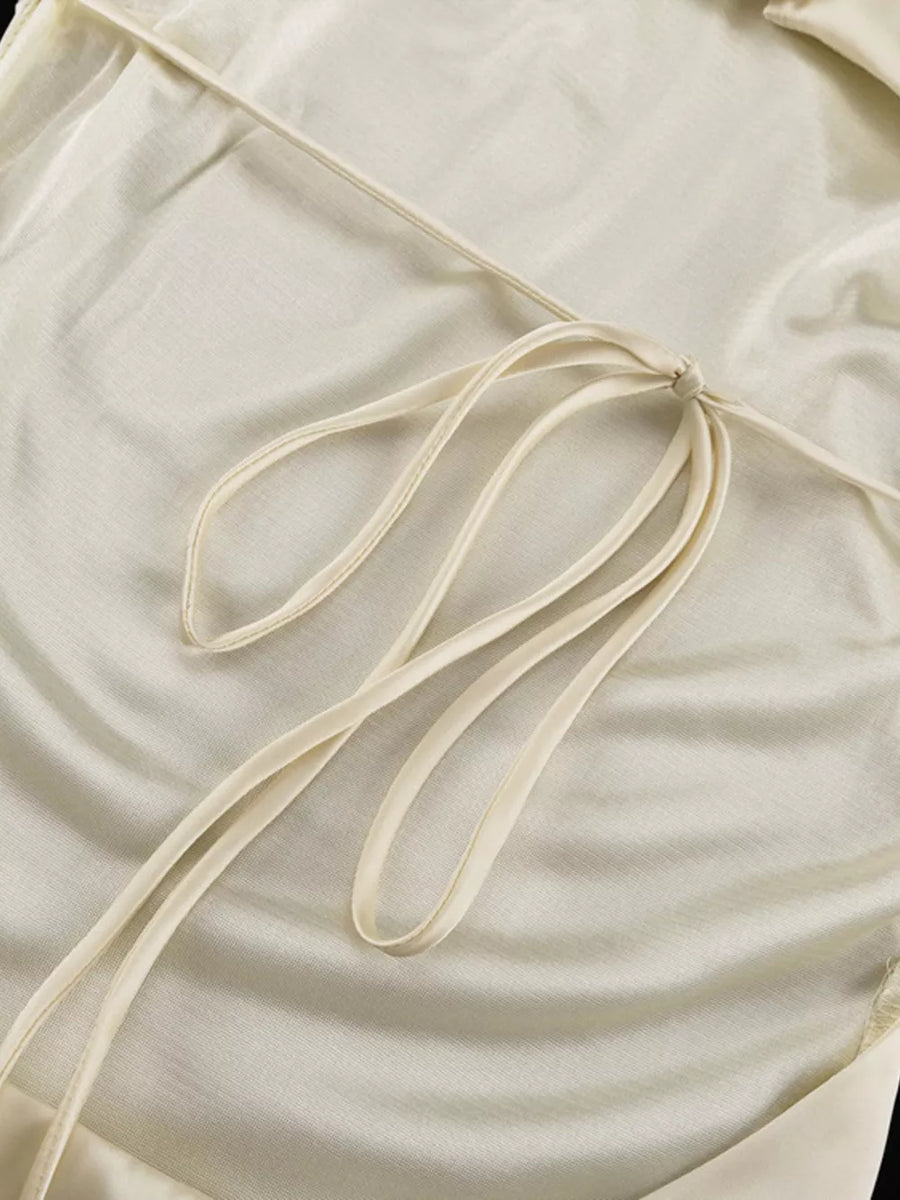 Cream satin halter top with tie back detail