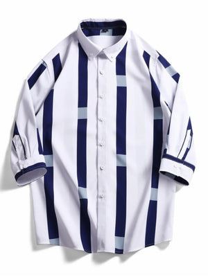 Oversized button-up shirt with white, navy, and light blue stripes.