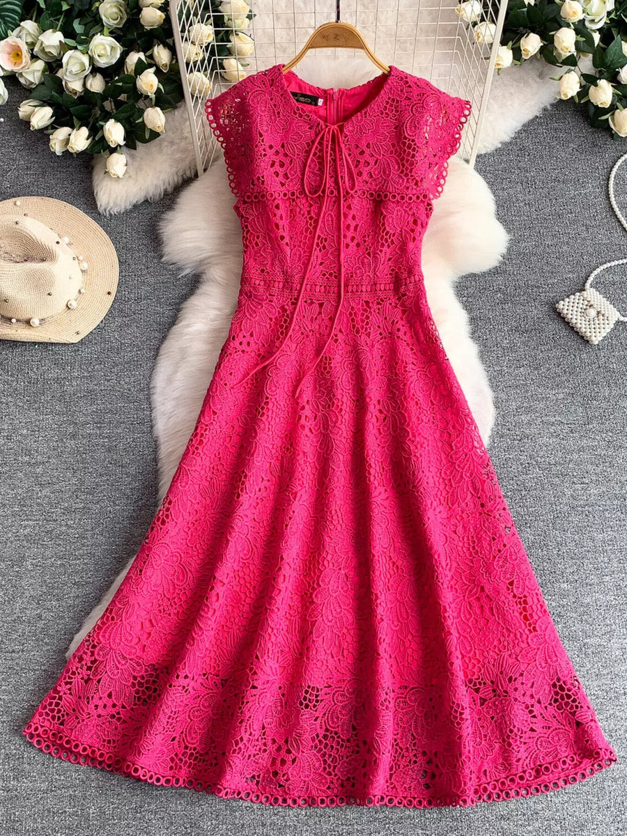 Fuchsia pink lace A-line dress with cap sleeves and tie detail neckline.