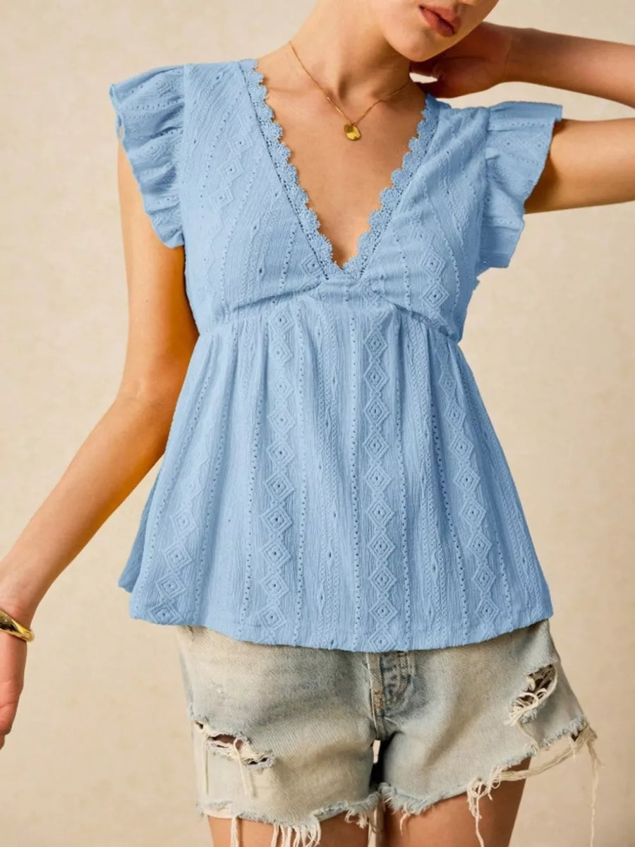 Light blue eyelet blouse with lace trim and ruffle sleeves.