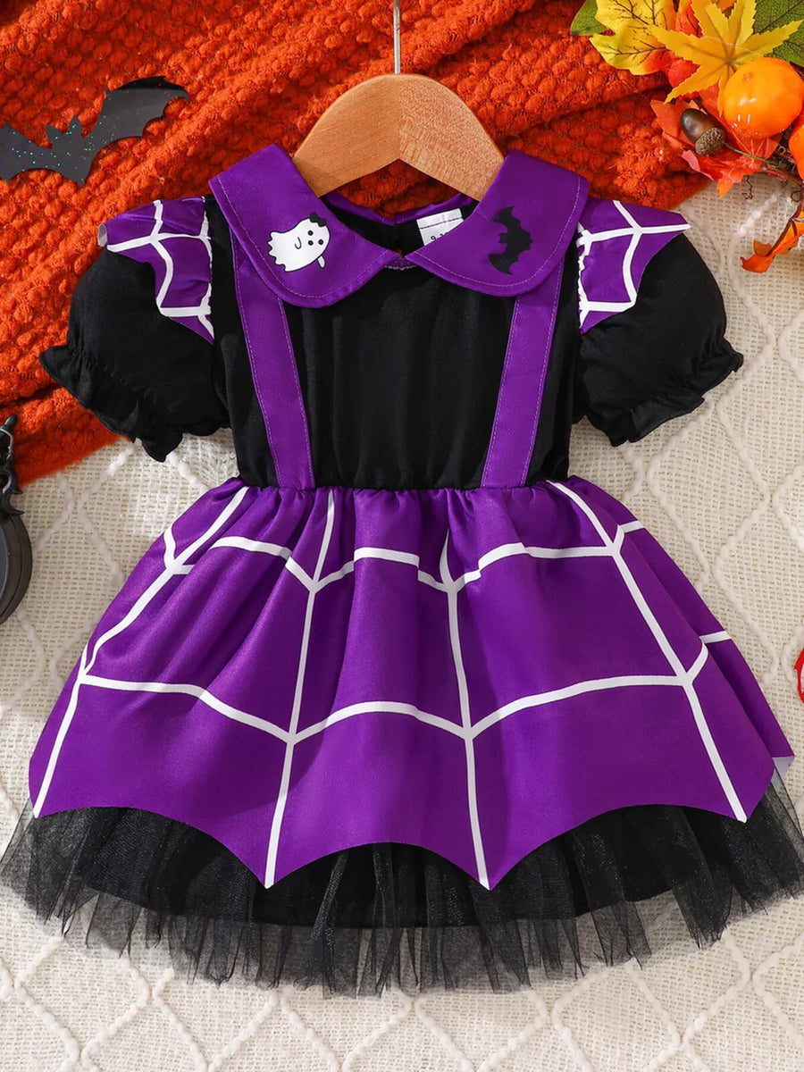 purple dress featuring ruffled and spiderweb