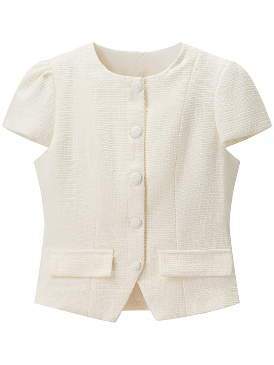 Textured cream button-down top with short puff sleeves and pocket details.