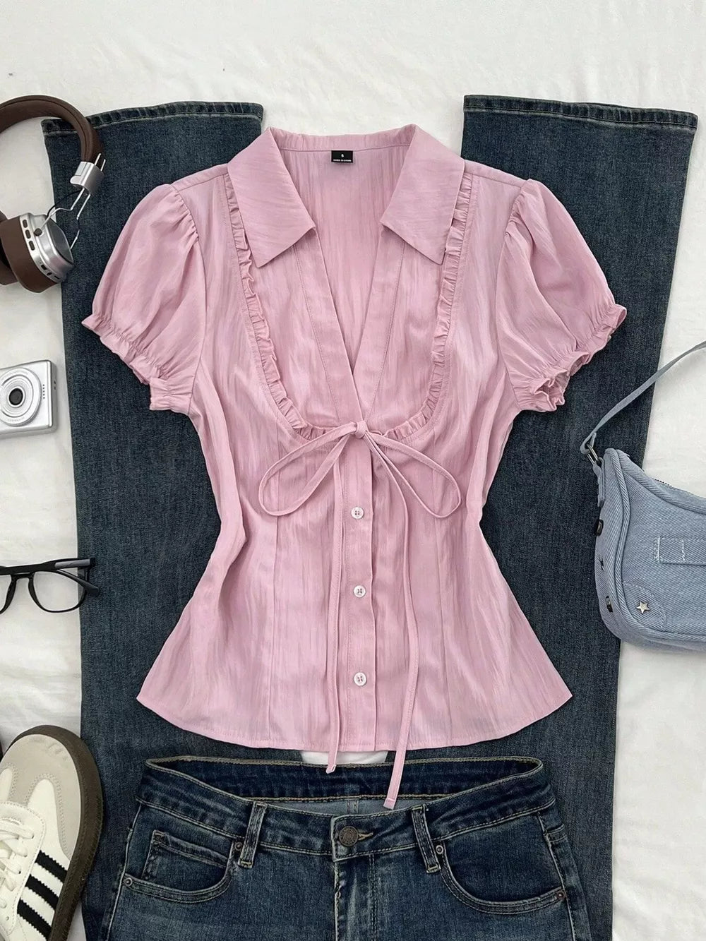 95% polyester, 5% spandex Care instructions: Machine wash cold button-up shirt in Pink with fitted silhouette