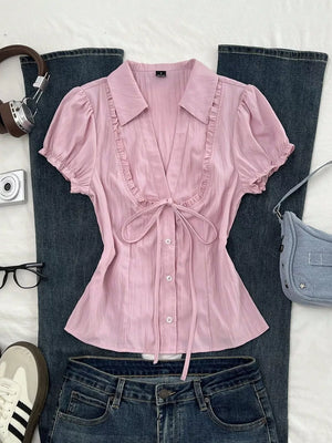 95% polyester, 5% spandex Care instructions: Machine wash cold button-up shirt in Pink with fitted silhouette