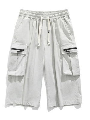 Light gray cargo shorts with zippered pockets and drawstring waist