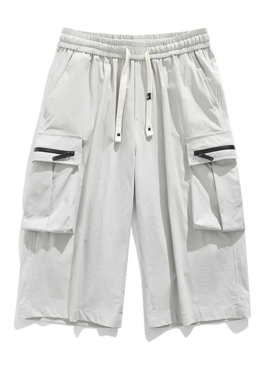 Light gray cargo shorts with zippered pockets and drawstring waist