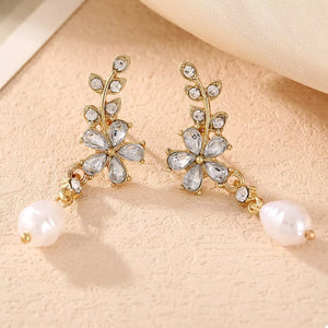 clear earrings featuring pearl drop and floral