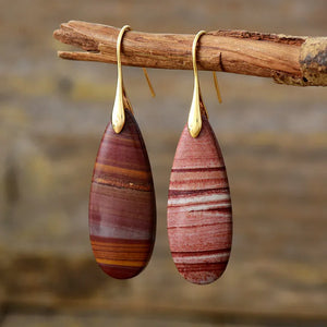 Stone grain teardrop dangle earrings with gold hooks, red and brown striped stones