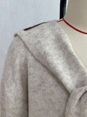 pullover sweater featuring geometric in cream with 100% polyester Care instructions: Machine wash cold texture