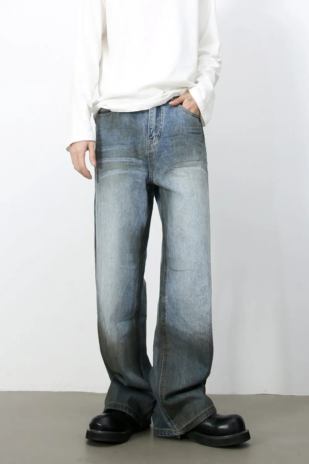Faded gradient wide-leg jeans in medium wash denim with a relaxed fit.