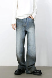 Faded gradient wide-leg jeans in medium wash denim with a relaxed fit.