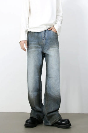 Faded gradient wide-leg jeans in medium wash denim with a relaxed fit.