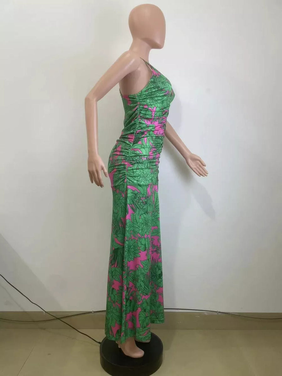 Tropical floral ruched maxi dress with spaghetti straps and a flattering fit.