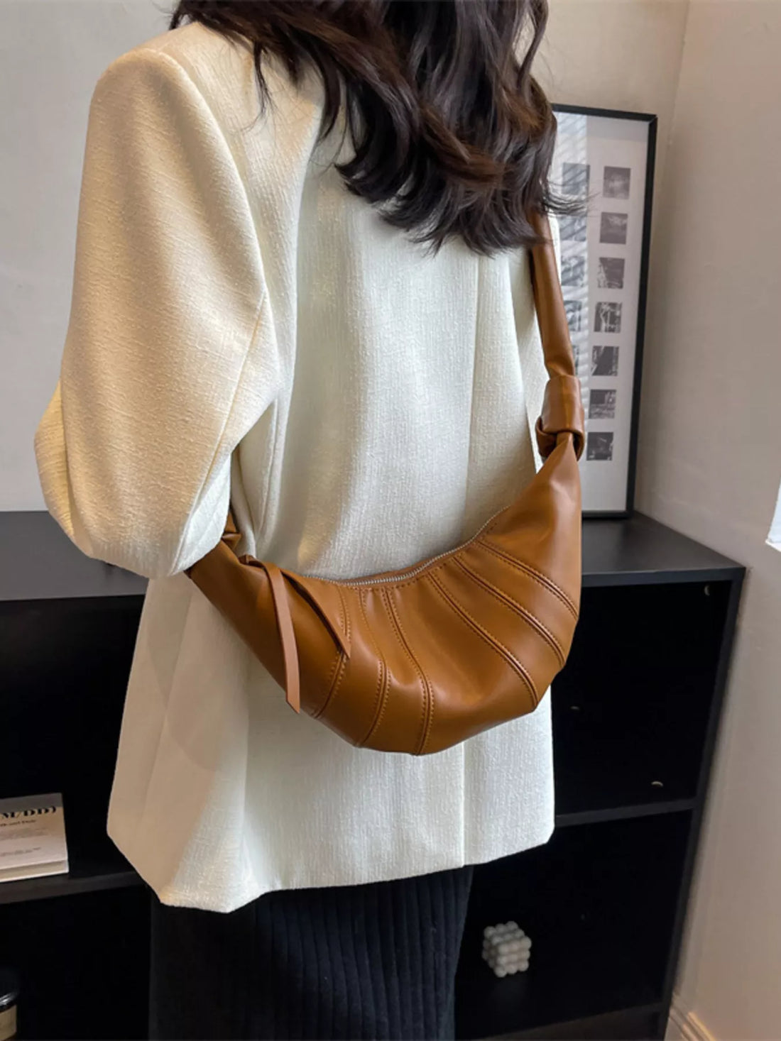 Chic Crescent Hobo Crossbody Bag in brown faux leather with a curved silhouette and stitched details.