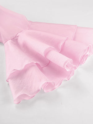 Blush pink ruffle trim long sleeve blouse with dramatic sleeves and ruffled cuffs.