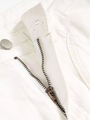 White sweatpants with zipper fly and button closure detail.