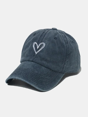 Washed cotton baseball cap in dark blue with white embroidered heart detail.