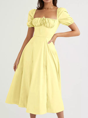 Pastel yellow puff sleeve tie front midi dress with square neckline and gathered bodice.