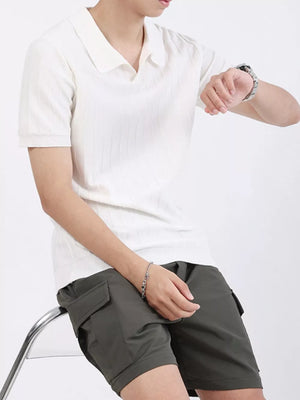 Men's white ribbed knit polo shirt with short sleeves and a classic collar.