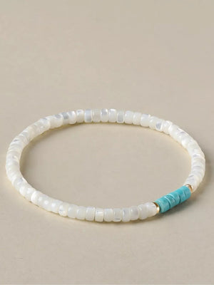 bracelet in white featuring beaded and beaded fit