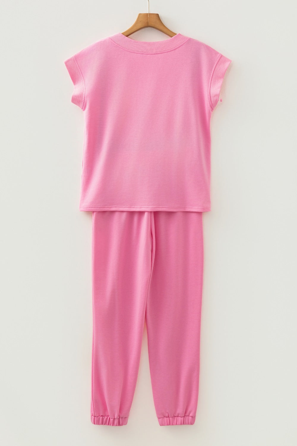 Pink cotton drawstring loungewear set with cap sleeve top and cuffed pants
