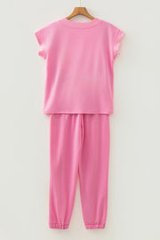 Pink cotton drawstring loungewear set with cap sleeve top and cuffed pants