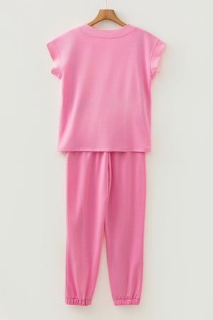 Pink cotton drawstring loungewear set with cap sleeve top and cuffed pants