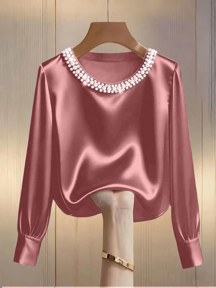 Pink satin blouse with pearl trim round neckline and long sleeves