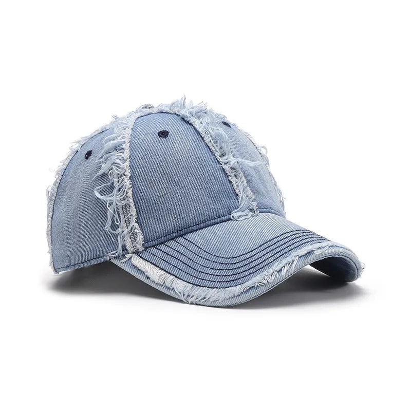 Light wash denim baseball cap with frayed edges and distressed details.