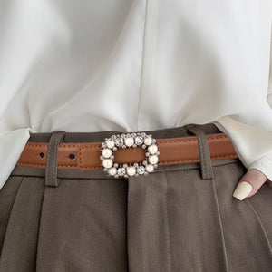 Brown leather belt with pearl and rhinestone buckle detail