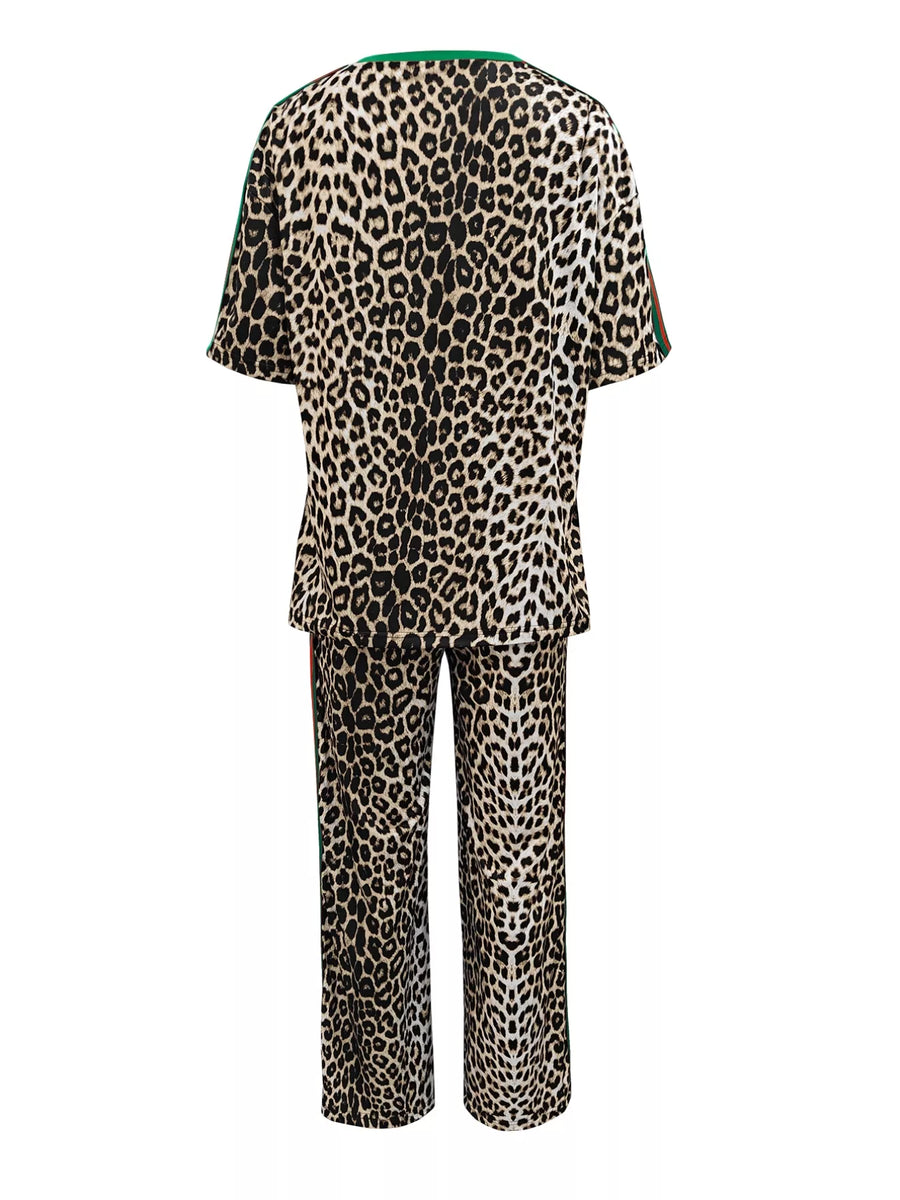 Leopard print loungewear set with green trim on neckline and sleeves.