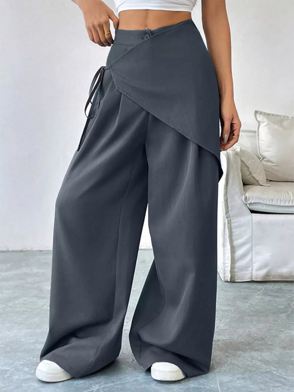 Gray wide-leg pants with a wrap-style overlay and tie waist