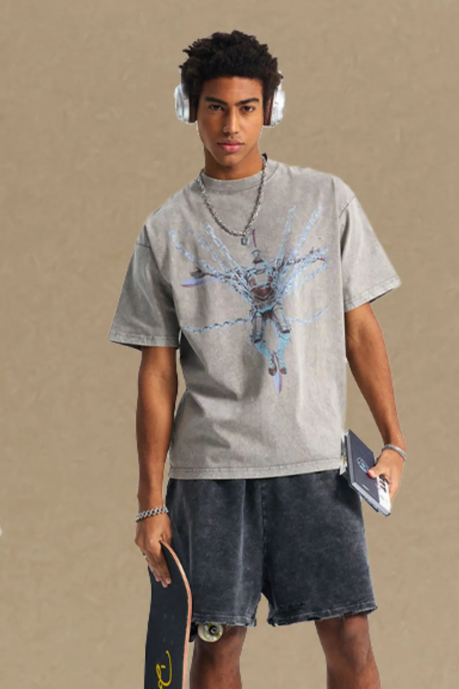 Acid wash graphic tee in gray with oversized fit and crew neck.