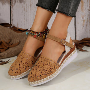 Brown crochet espadrille sandals with ankle strap and buckle detail.