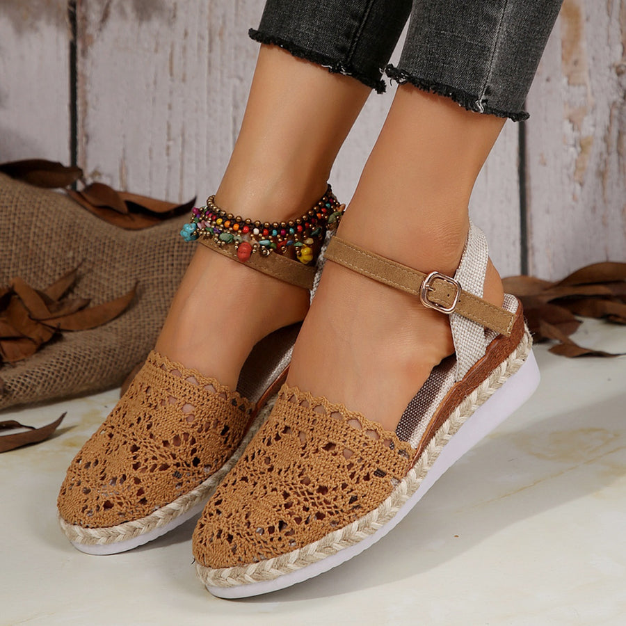 Brown crochet espadrille sandals with ankle strap and buckle detail.