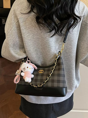 Chic plaid shoulder bag with chain accent and Hello Kitty charm