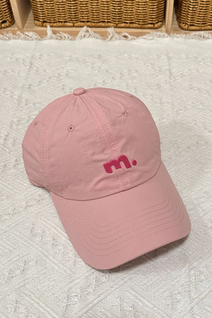Pink baseball cap with embroidered pink 'm' logo