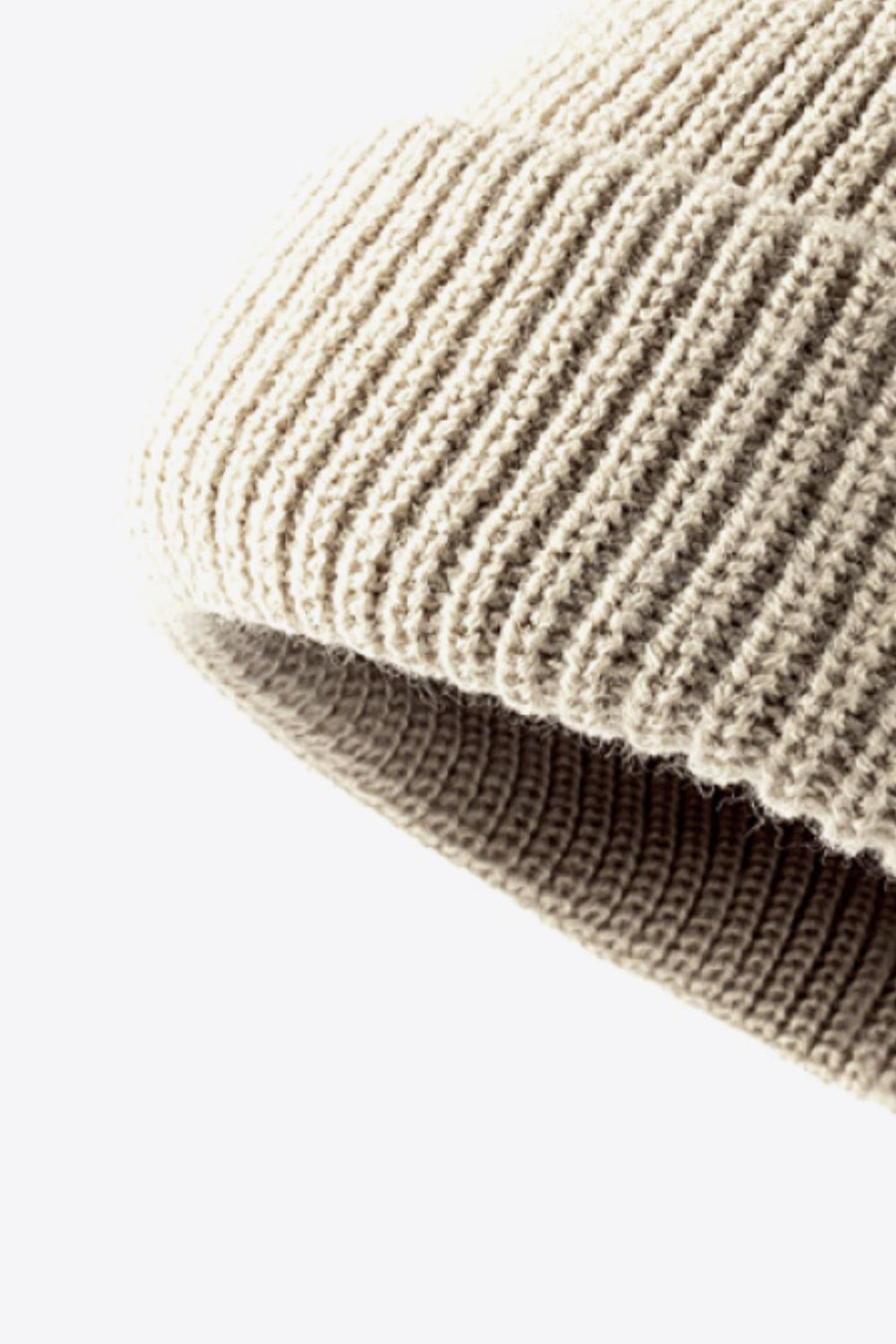 Beige ribbed knit beanie with folded edge detail