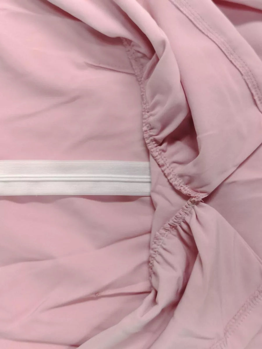 Pink midi dress with elastic waistband and ruffled detail