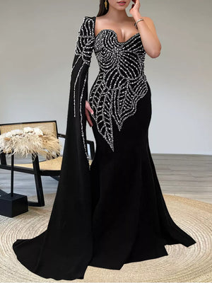 formal gown in black featuring rhinestone embellishment and mermaid fit