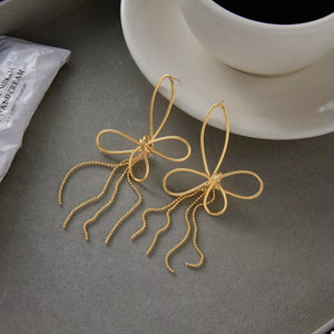 Gold dangle earrings with N/A