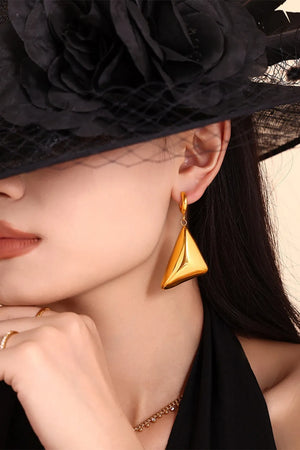 Gold pyramid drop earrings with a polished finish.