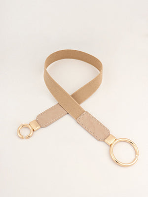 Tan elastic belt with faux leather ends and gold interlocked ring buckle